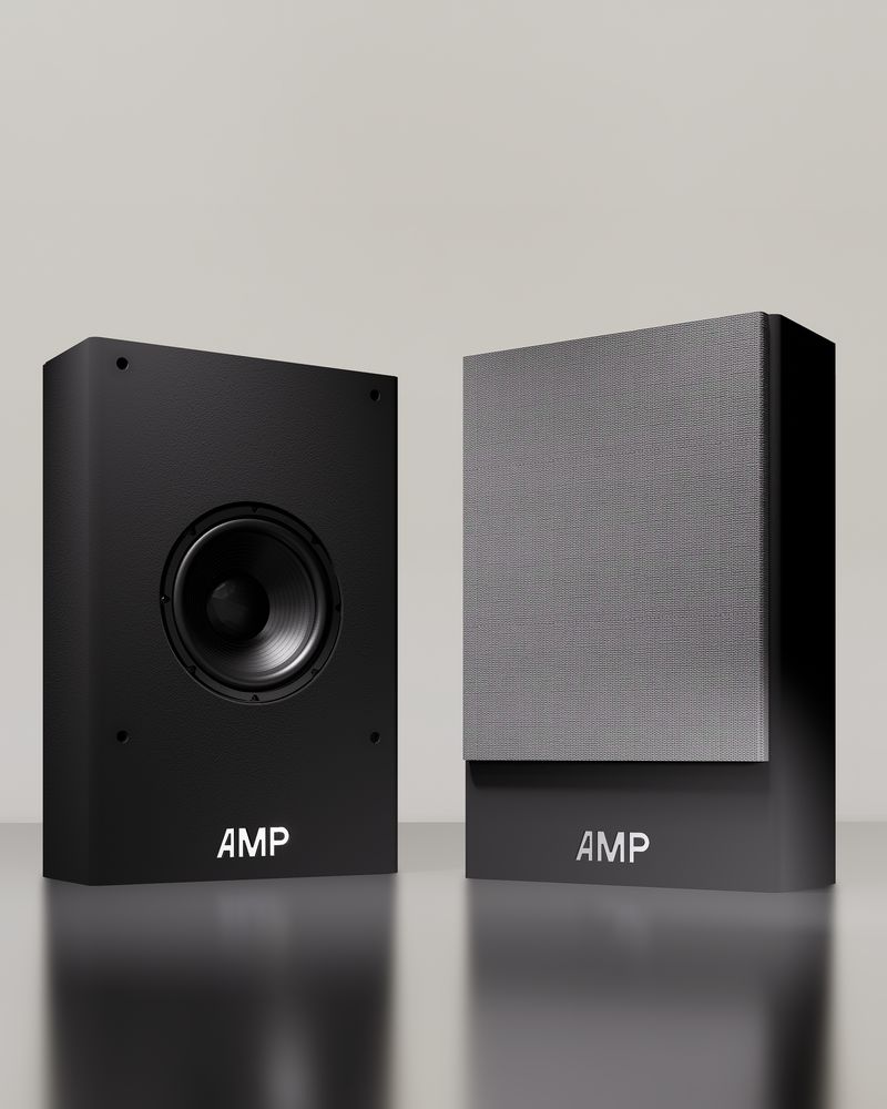 Two Cinema Pro 6 loudspeakers on a light background, one with its grille fitted